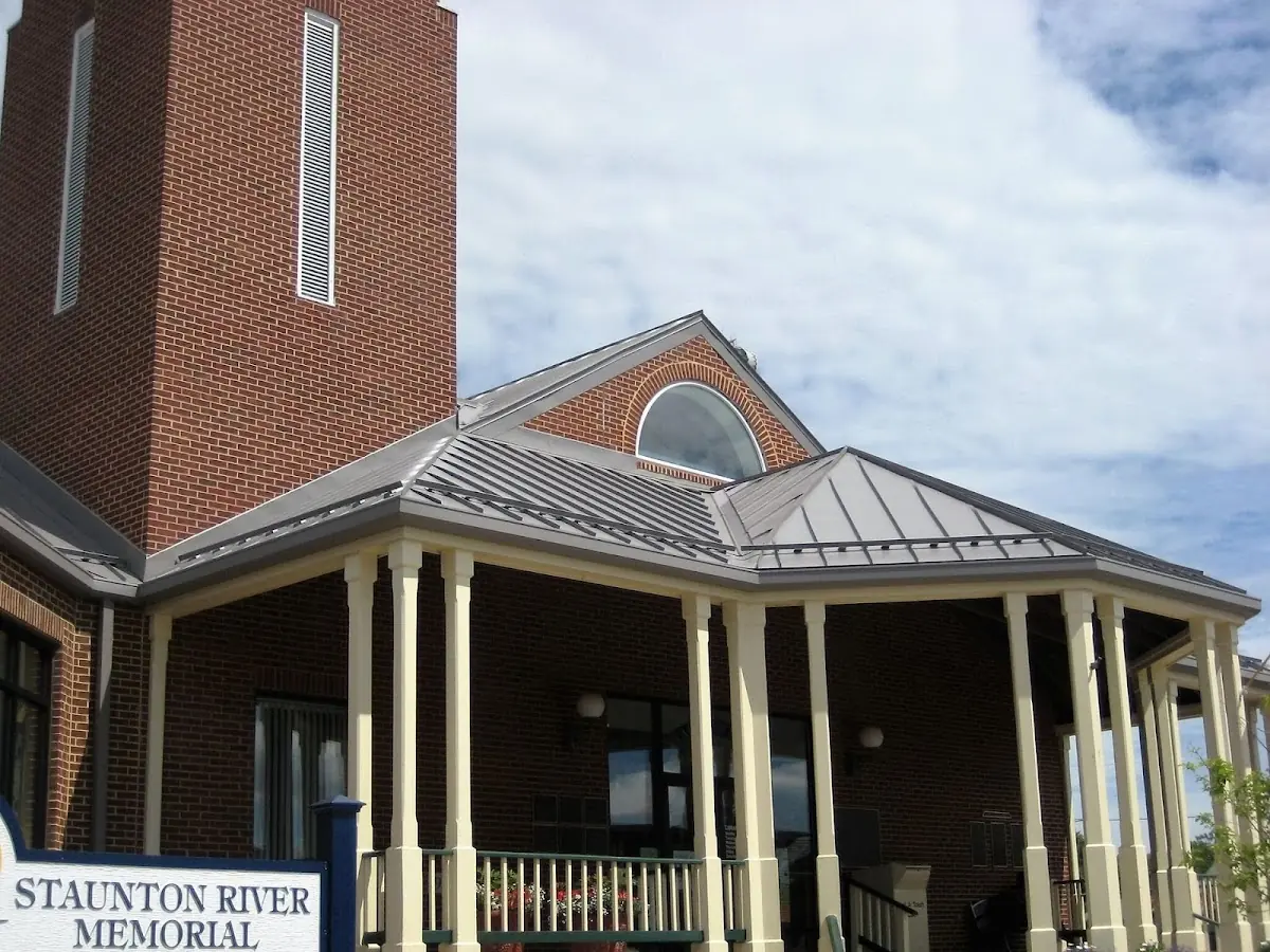 Skilled roofing craftsmen working on a residential roof in Brookhaven